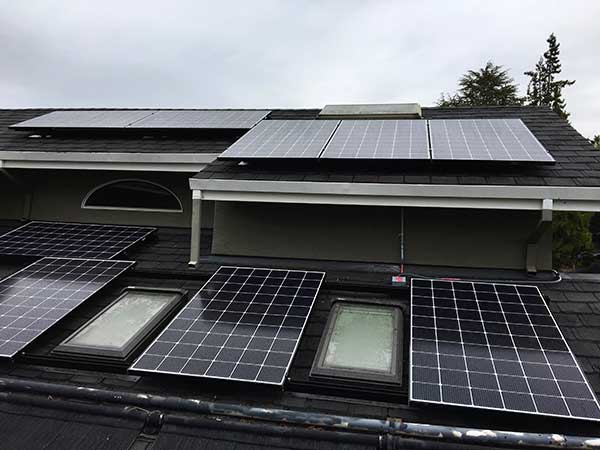 A building with solar panels on the roof.