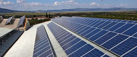 A large solar panel array on top of a building.