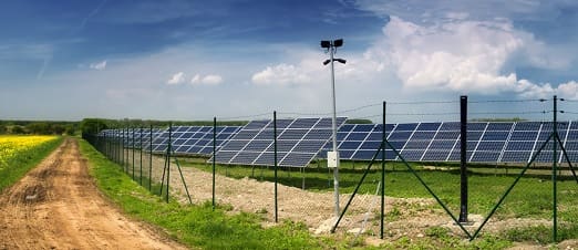 A field with many solar panels on it