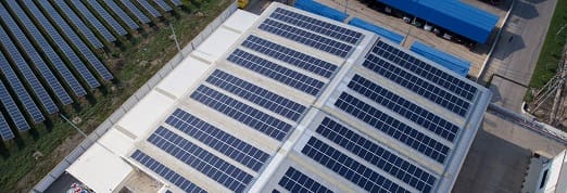 A large solar panel array on the roof of a building.